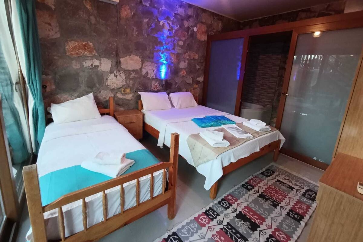 Economy Triple Room, Partial Sea View | Desk, free WiFi