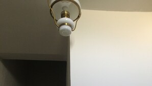 A staircase with a light fixture at the top. - Dwelling in farmhouse with independent entrance (no shared rooms) (Pertuis)