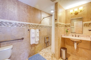 A bathroom with a shower, toilet, sink, and a mirror. - Emigrant Lodge w/ Spa: 3 Suites Near Yellowstone (Emigrant)