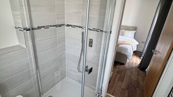 Shower, towels, toilet paper