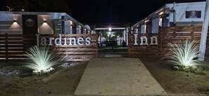 A gated entrance to a property with the name 'ardines inn' displayed prominently. - Jardines Inn (Trinidad)