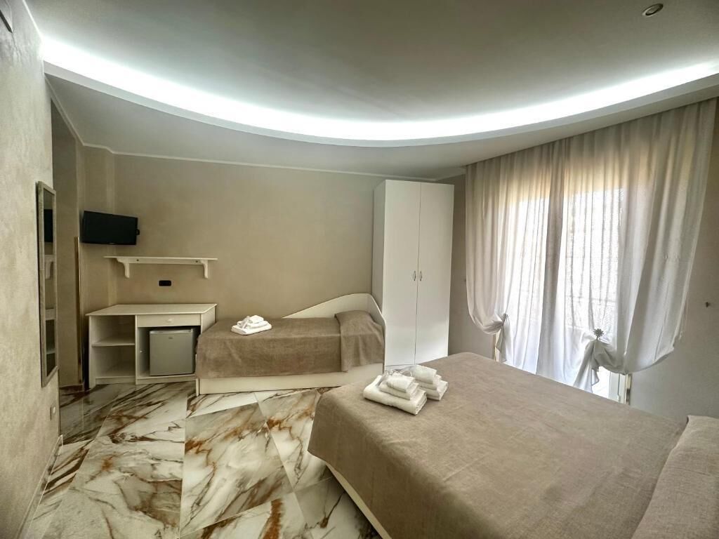 Family Room, Balcony, Partial Sea View | Desk, laptop workspace, free WiFi