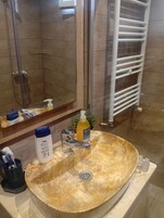 Deluxe Apartment, Balcony, City View | Bathroom | Shower, free toiletries, hair dryer, towels