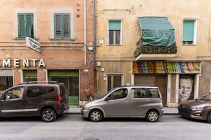 A street with parked cars and a building with a sign that reads 'FERRAMENTA TURCHI'. - A bright apartment that sleeps up to four people, renovated with furnishings made by local artisans and located on the fourth floor (no elevator) in one of Livorno's most characteristic areas. The location is strategic: the sea and main attractions are w (Livorno)