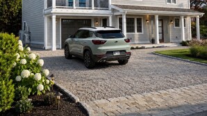 A two-story house with a garage, a driveway, and a car parked in front. - Amazing Narragansett house - 5+ bdrm - Brand New!! (Narragansett)