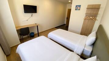 Twin Room | Premium bedding, down duvets, desk, laptop workspace