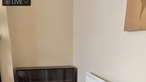 A white table with a bench, wooden flooring, and a radiator. - Eden homez (Bristol)