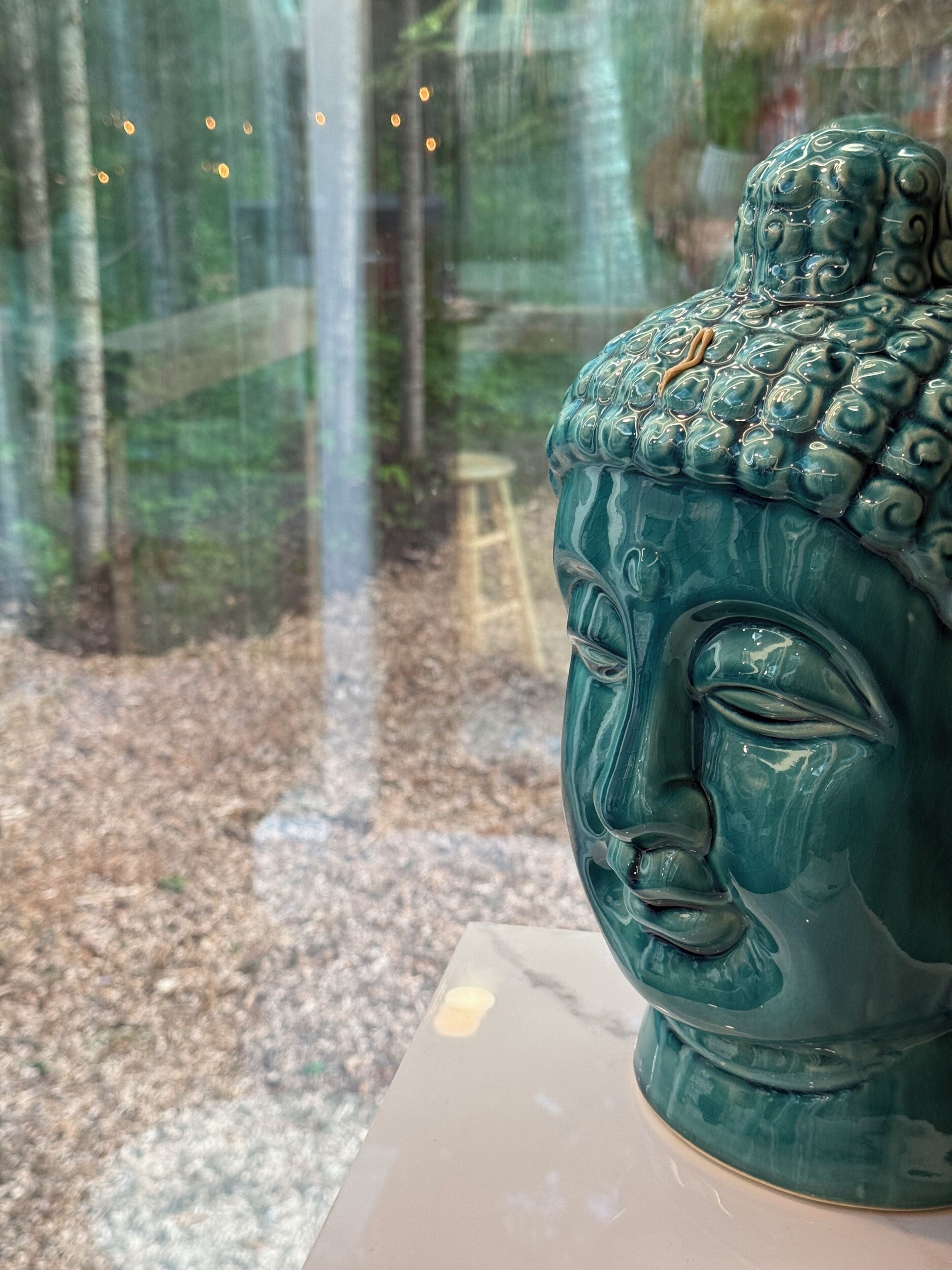 A sculpture with a textured surface and a pedestal.