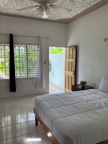 The Suite One, Negril with onsite bar and sea view roof-deck access.