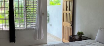 The Suite One, Negril with onsite bar and sea view roof-deck access.