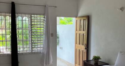 The Suite One, Negril with onsite bar and sea view roof-deck access.