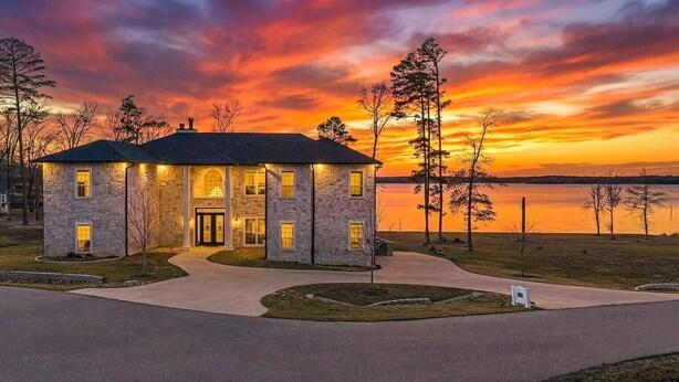 A stone house with a driveway and a mailbox. - Lakefront Estate Sleeps 18, Bunk & Game Room & Boat House w/Swim Hole & Kitchen! (Pittsburg)
