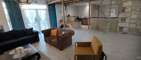 Smart TV, fireplace, table football, books