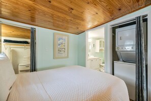 Suite bedroom with a sliding glass door providing direct access to the outdoors. - Bayou Villa w/ Dock, Kayaks & Fire Pit Fun (Pensacola)