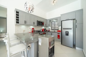 Fridge, microwave, oven, stovetop - Brand-New Luxury Villa • Pool & Privacy (Sosúa)