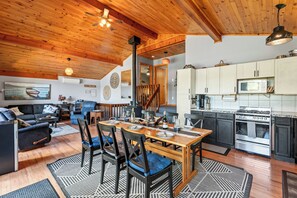 A cozy interior with a dining area, kitchen, and living space.