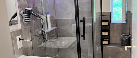 Shower, hair dryer, towels, soap
