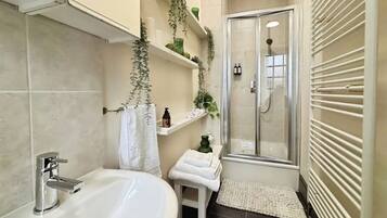 Shower, hair dryer, towels, soap