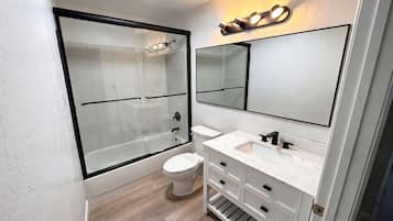 Combined shower/bathtub, hair dryer, towels, soap
