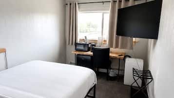 Economy Room, 1 Queen Bed, Non Smoking | Desk, laptop workspace, blackout curtains