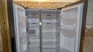 An empty refrigerator with multiple transparent drawers and a 'Twin Cooling' label. - A comfortable family apartment in tangier. (Tanger)