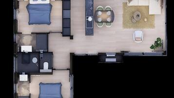 A room with a bed, a desk, a chair, a small table, and a sofa.