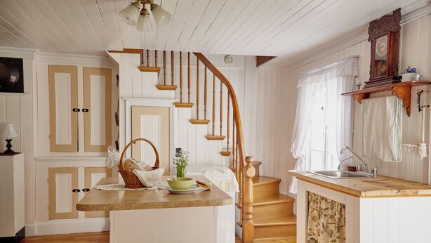 A kitchen with a wooden staircase, a sink, and a cabinet. - Comforter and garden #281772 Au rythme d'avant... (Berthier-sur-Mer)