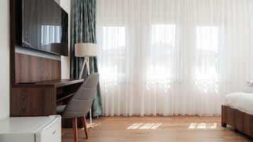 Deluxe Triple Room, City View | Desk, laptop workspace, free WiFi