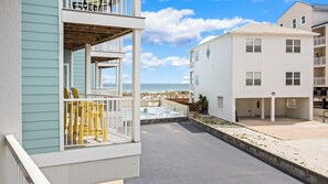 A beachfront property with a balcony, a pool, and a view of the beach. - Steps to the Sand: Romar Beach 106 (Orange Beach)