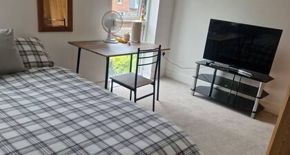 Two rooms in a very quiet and clean environment. Central to getting services