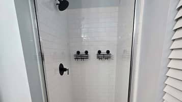 Shower, hair dryer, towels, toilet paper