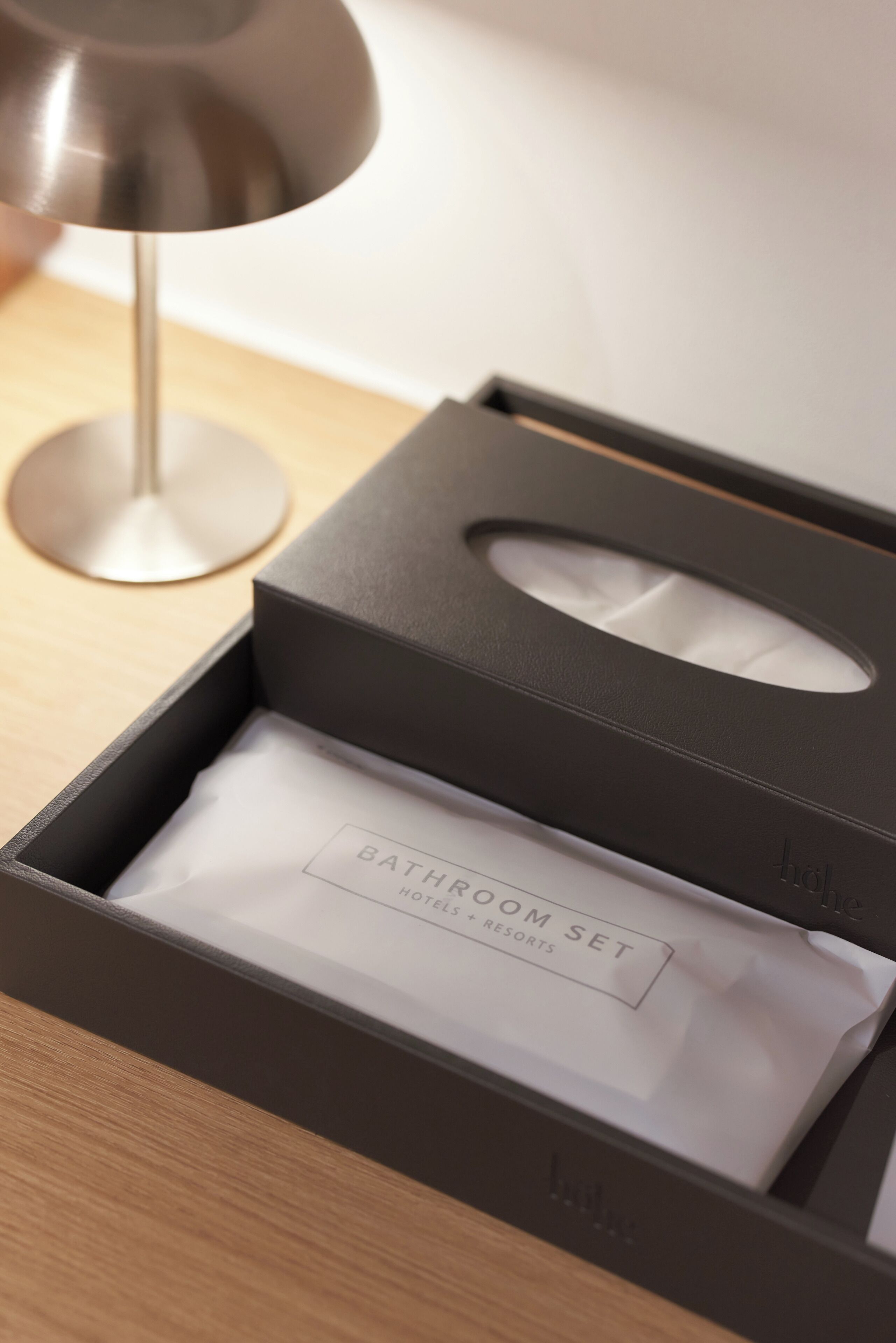 A black box with a label 'BATHROOM SET' and a tissue.