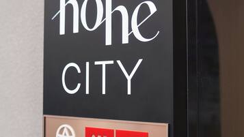 A sign with 'høhe CITY' and 'ASIA DESIGN AWARD 2024' text, directed by HOANG GROUP.