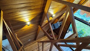 A wooden staircase with a geometric design, leading to an upper level. - Hidden Luxury Cabin in Nature Jacuzzi, Fire Pit & Private Escape (Gobierno Regional de Lima)