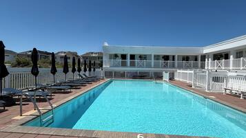 Seasonal outdoor pool, open 9:00 AM to 9:00 PM, pool umbrellas