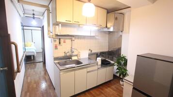 Fridge, microwave, electric kettle, dining tables