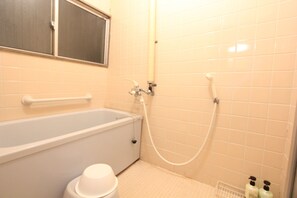 A bathroom with a bathtub, a toilet, a shower, and a window. - Right near Ikebukuro! 1-minute walk from Nakamurabashi Station / 8 guests (練馬区中村北3丁目)