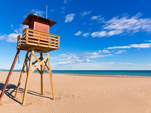 A wooden lifeguard tower on a sandy beach with a clear blue sky. - Le Beaupré by Interhome (Canet-Plage)