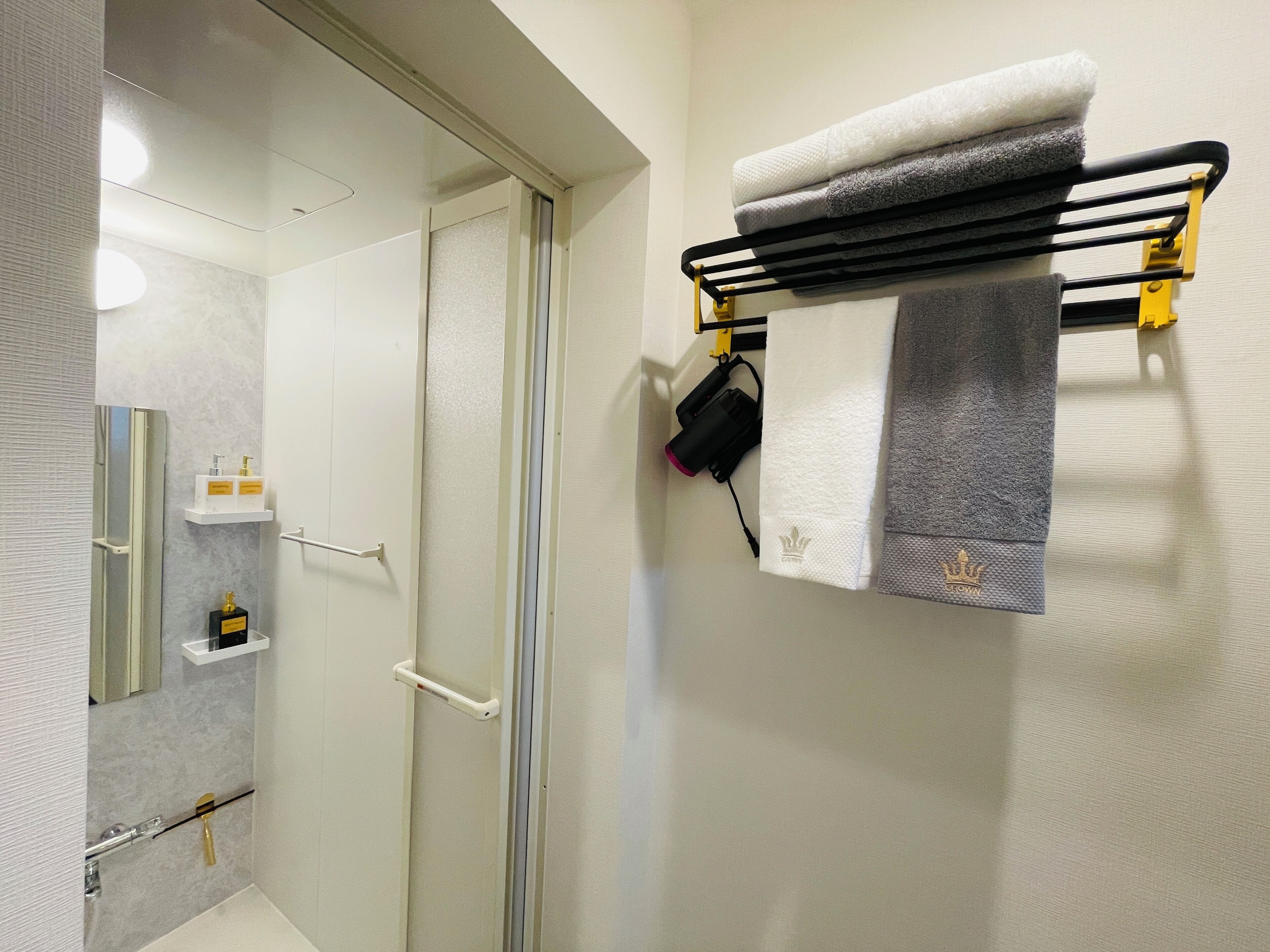 Shower, hair dryer, towels, soap