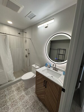 Shower, hair dryer, towels, soap