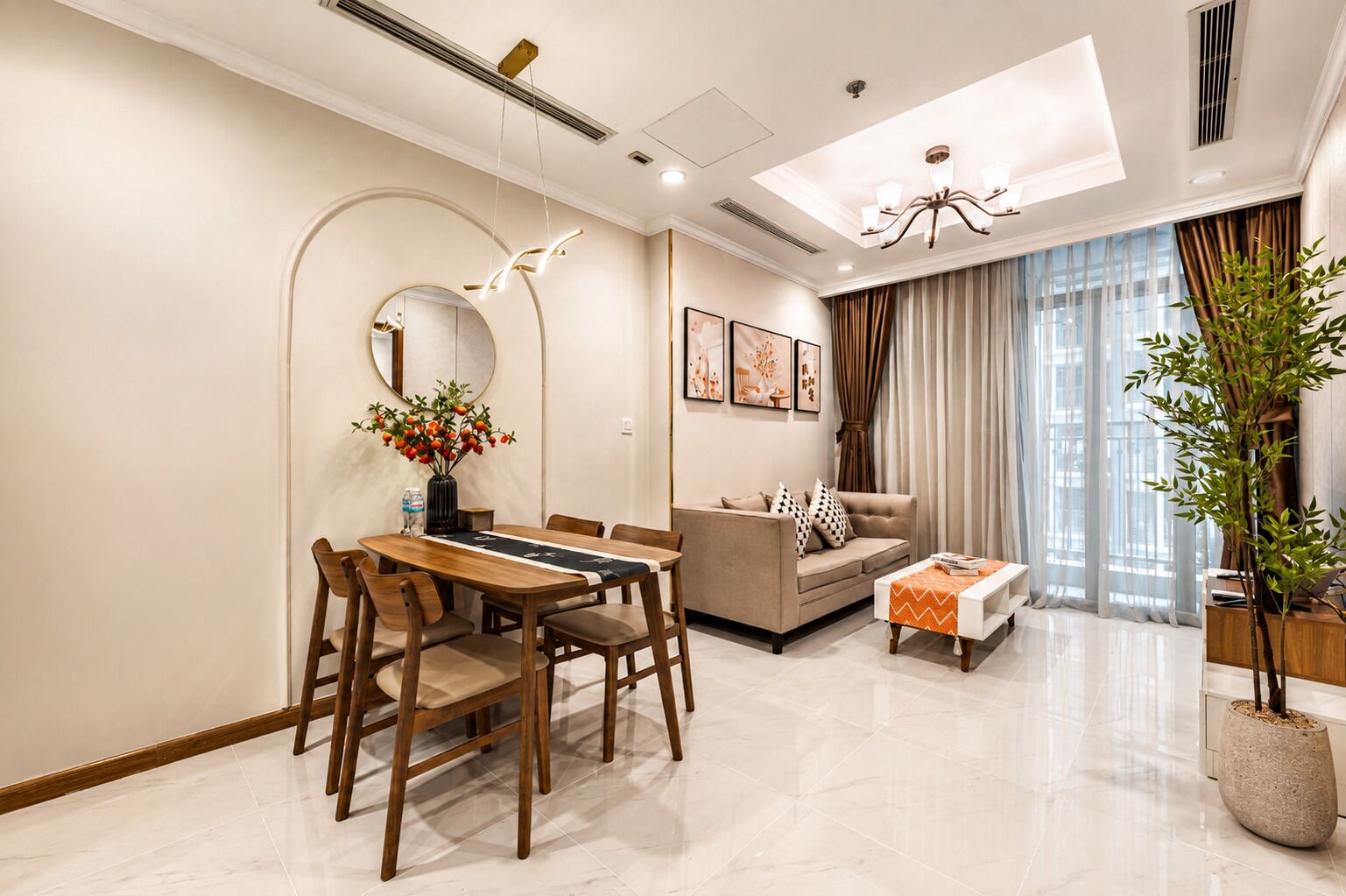 A modern living room with a dining area, a sofa, a coffee table, and a large window with curtains.