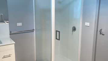 Shower, towels, soap, toilet paper