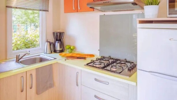A kitchen with a sink, stove, and refrigerator. - Comfort Plus Stay by Adriatic for 7 (Brtonigla)