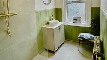 Shower, hair dryer, towels, soap