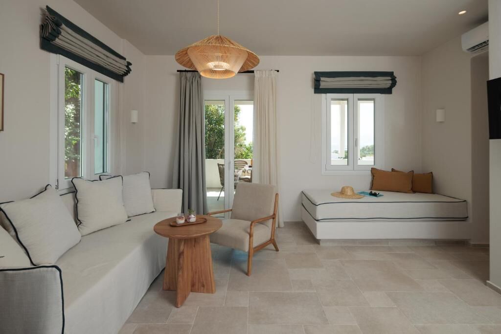 Grand Apartment, Balcony, Sea View | Living area | 42-inch Smart TV with satellite channels