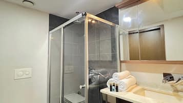 Superior Suite, City View | Bathroom | Shower, hair dryer, towels, soap