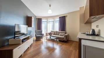 Superior Suite, City View | Living area
