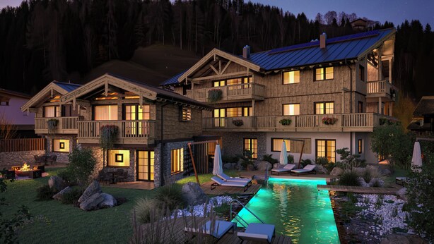 A large wooden lodge with multiple balconies and a swimming pool. - MOAHOF Chalets & Appartements (Wagrain)