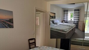 Une pièce avec un lit, une chaise, une porte et un tableau au mur.