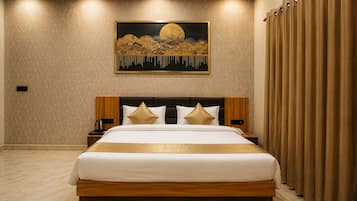 A neatly made bed with a headboard, a bedside table, and a wall-mounted painting.